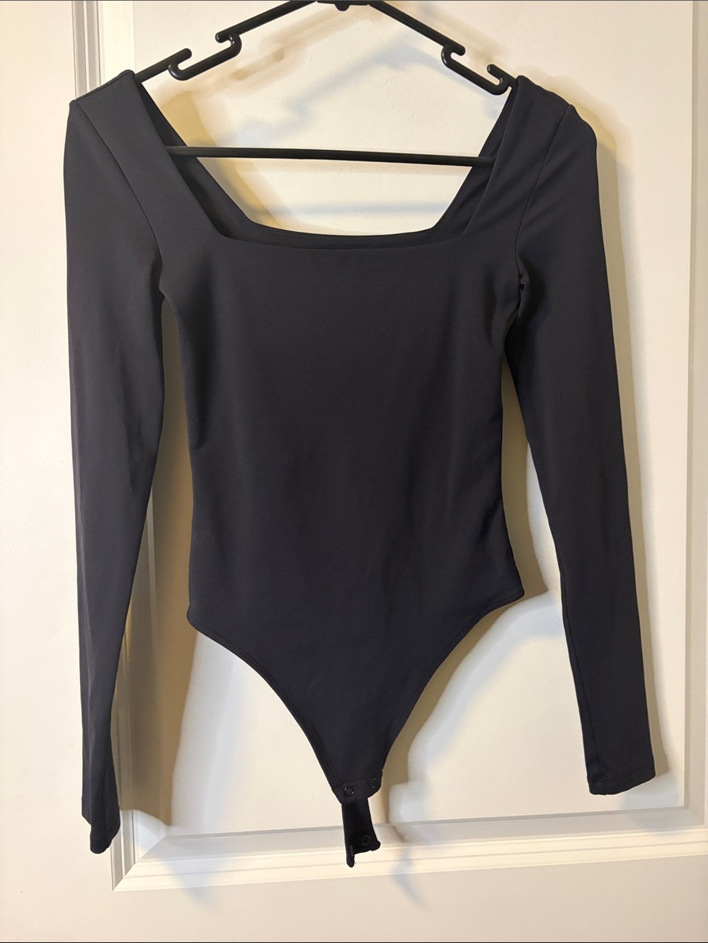 Babaton Black Long-Sleeve Square Neck Bodysuit with Snap Hem